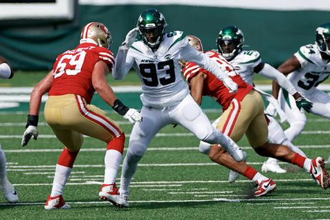 Adam Hunger and AP Tarell Basham (93)