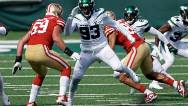 Adam Hunger and AP Tarell Basham (93)